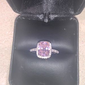 Pink quartz ring in silver.  Size 5.  CZ surrounding ring.